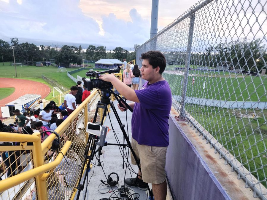 Jackson Coyle operating the tight shot of the HHS vs. Jesuit Jamboree