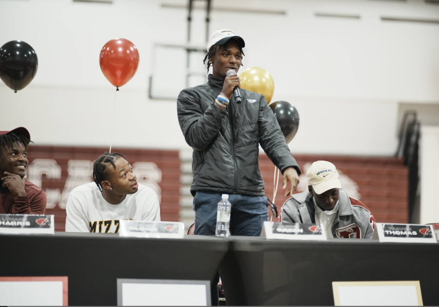 Record number of Destrehan High School student athletes commit to colleges